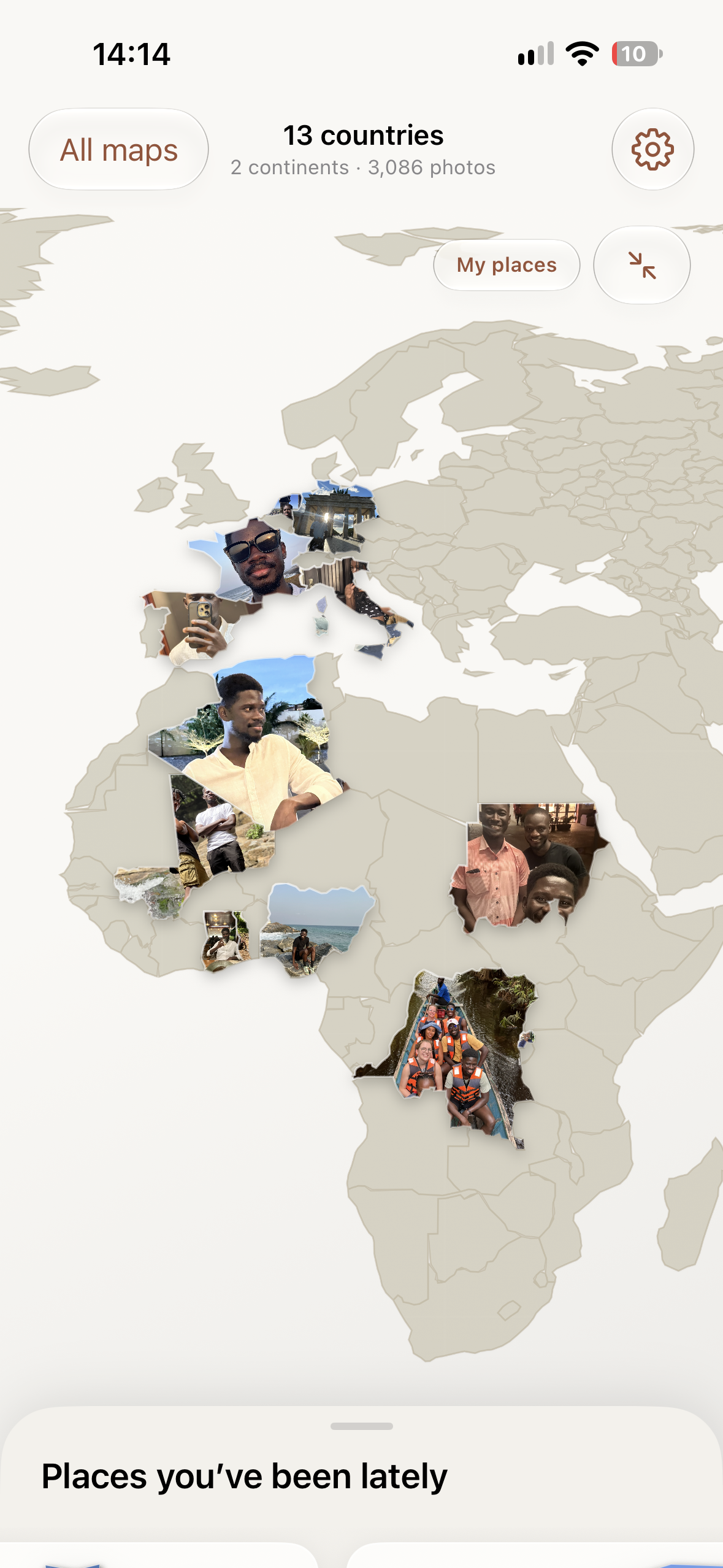 PhotoMap on iPhone, with travel photos filling countries in Europe and Africa